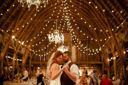 Couple dancing barn weddin