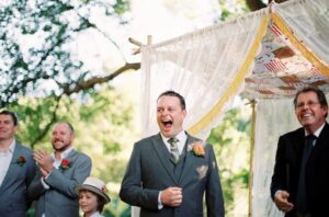 groom first look reaction