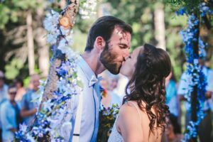 bride and groom first kiss